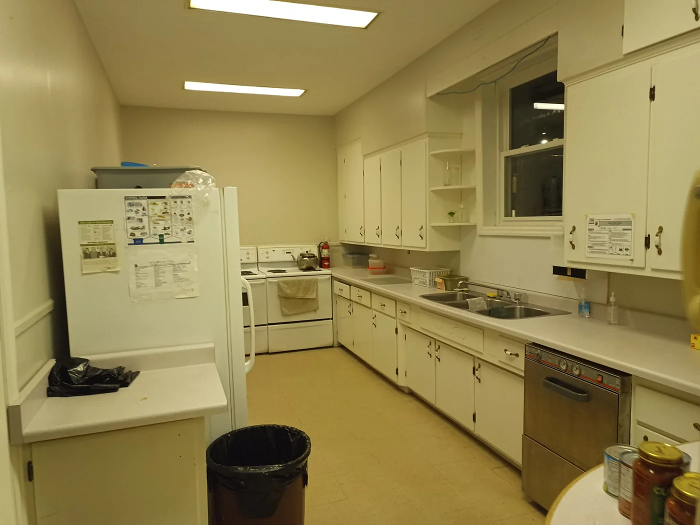 Kitchen facilities with refrigerator, stove, counters, cabinets and double sink